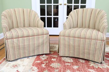 Two Rounded-Back Upholstered Chairs With Pleated Skirting