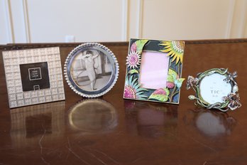 Four Small Photo Frames With Intricate Borders