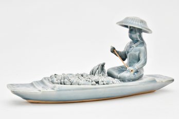 Asian Porcelain Figurine Of A Man On A Boat