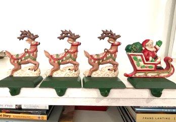 Four Small Metal Santa And Reindeer Stocking Holders