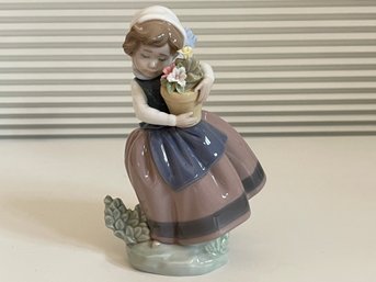 Lladro Girl Holding Flowers