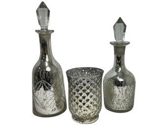 Pair Of Distressed Glass Decanters And Candle