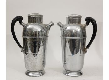 2 Shakers With Black Handles