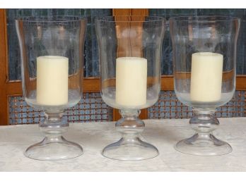 Set Of Three Glass Hurricane Candle Holders With Candles