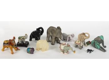 A Set Of 12 Elephant Figurines
