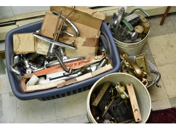 Bins Of Sink Faucets And Old Door Knobs Including Glass Knobs