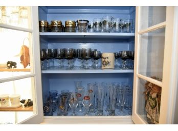 3 Shelves Of Assorted Beer And Drinking Glasses