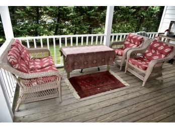 Resin Wicker Look Outdoor Seating Area With Weathered Table