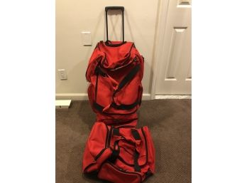 Two Canvas Red Duffel Bags