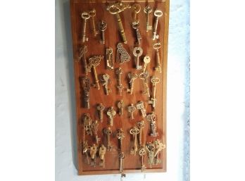 Collection Of Antique Brass Skeleton Keys With Wall Board