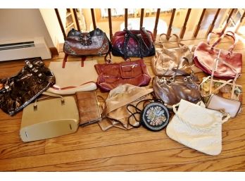 Assortment Of Different Colored  Handbags And Pocketbooks