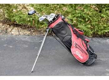 Assortment Of Golf Clubs With Walking Carts