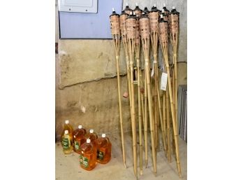 Assortment Of Backyard Tiki Torches With Torch Fuel