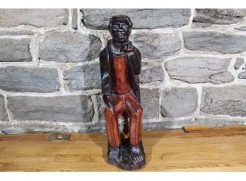 Carved Wood Man Sitting In Chair Statue