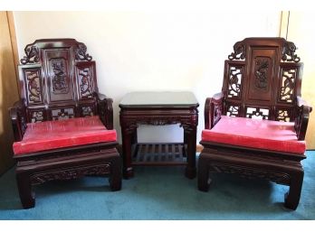 Outstanding Pair Of Carved Rosewood Chairs With Dragon And Elephant Motif And Matching Side Table