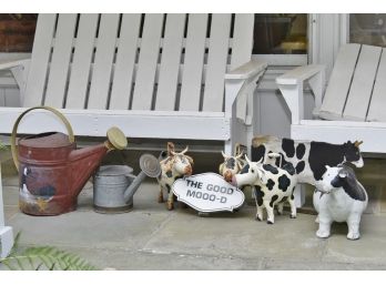 Vintage Cow Watering Cans And Decor
