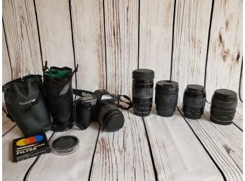 Vintage Canon SLR Camera With Additional Lenses