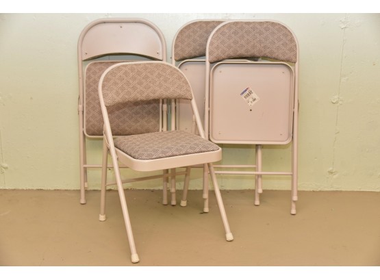 Four Cushioned Folding Chairs