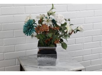 Faux Flowers With Silver Colored Planter