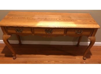 Oak Console Table Featuring Queen Anne Style And Three Drawers With Brass Pulls