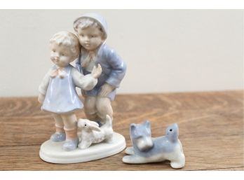 Boy & Girl With Dog Figurines