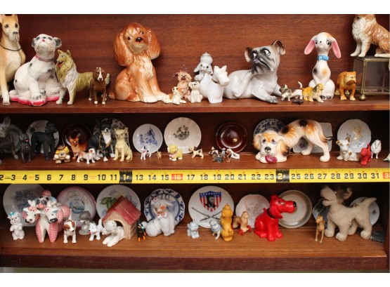 Three Shelves Of Dog Figurines (Bottom)