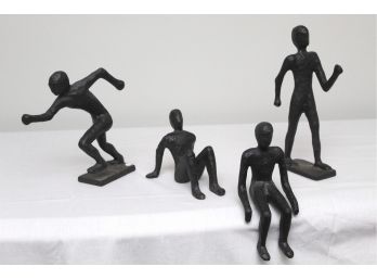 Faceless Men Collection Of Four Cast Iron Figurines