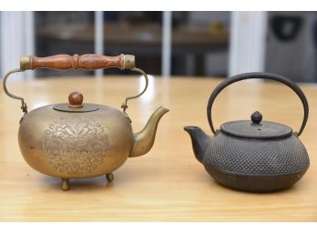 Two Tea Pots Including Brass And Cast Iron