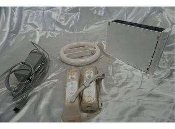 Wii Console Including Controllers, Wheel And Power Cord (powers On)