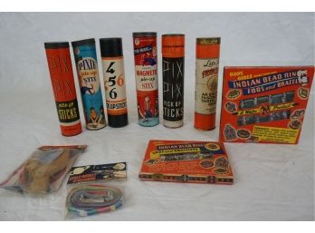 Group Of Vintage Toys Including Pickup Sitcks, Slingshot, Indian Bead Rings And Cycle Rocket Streamers