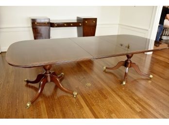 Dual Pedestal Banded Mahogany Dining Table With Additional Leafs And Pads