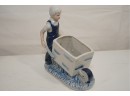Boy And Wheelbarrow Porcelain Figurine