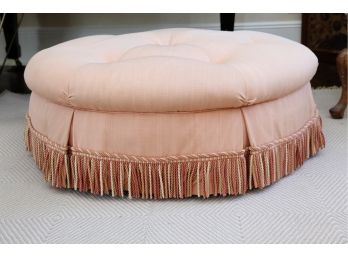 An Oversized Pink Ottoman With Frilled Bottom
