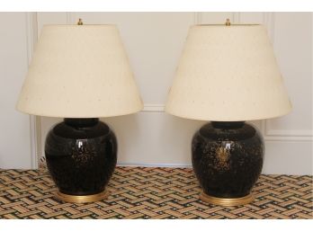 A Pair Of Antique Black Metal With Gold Leaf Trim Lamps