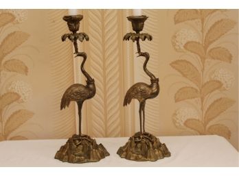 An Antique Pair Of Brass Peacock Candlesticks