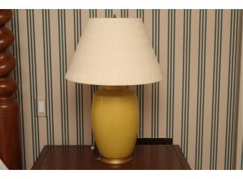 A Matching Pair Of Mustard Colored Table Lamps With Custom Shades