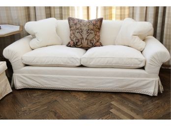 A Custom Damask Fabric Covered Sofa With Matching Throw Pillows