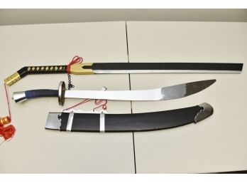 Pair Of Practice Swords (one Metal, One Plastic)