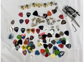 Collection Of Guitar Picks, Knobs And More