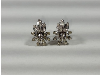Pair Of Krementz Costume Jewelry Earrings With Silver Colored Floral Pattern And Faux Diamond Center Stone