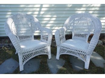 A Matching Pair Of White Wicker Arm Chairs