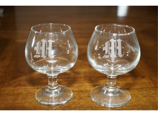A Matching Set Of Monogramed M Scotch Glasses
