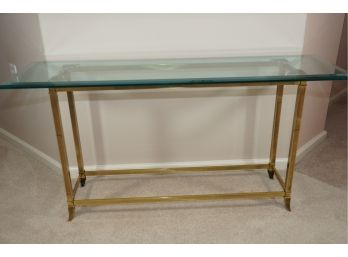 A Brass Base Console Table Featuring Beveled Glass Top