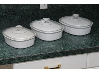 A Collection Of Oval Pyrex Dishes With Lids