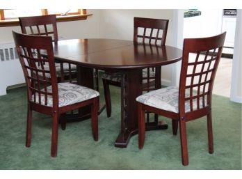 A Mahogany Dining Set Including Four Chairs