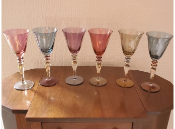 A Selection Of Six Colored White Wine Glasses