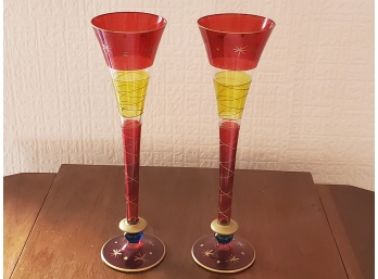 A Tall Pair Of Red And Yellow Pilsner Glasses