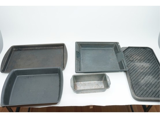 A Group Of Baking Pans Including 18' X 12' And Loaf Pan
