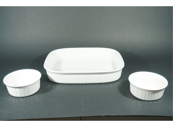 A Trio Of French White Corning Ware Including Ramekins And 4.5l Serving Dish