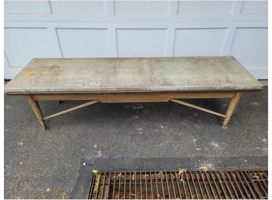 A Weathered Marble Top Outdoor Wooden Bench